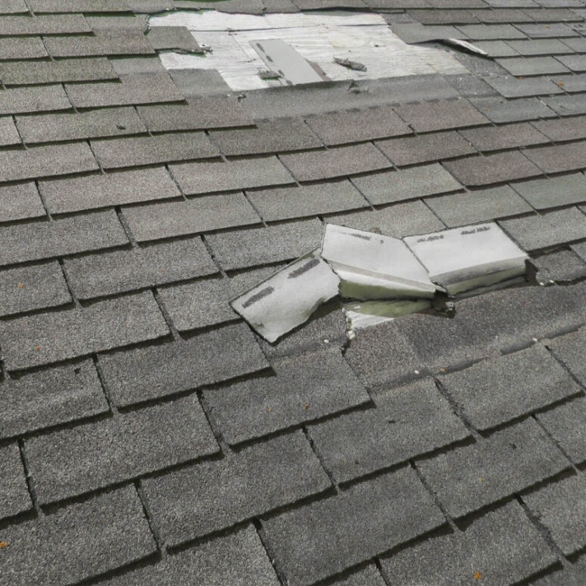 missing and damaged shingles on roof