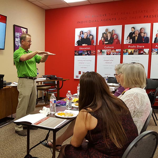 man speaking to class